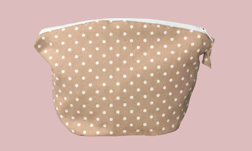 Beige dot cosmetic travel pouch for makeup, skincare and beauty essentials